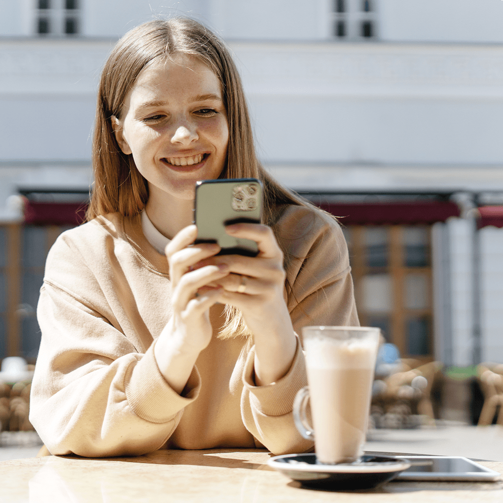 female-student-uses-phone-caferestaurant-city-min female-student-uses-phone-caferestaurant-city-min